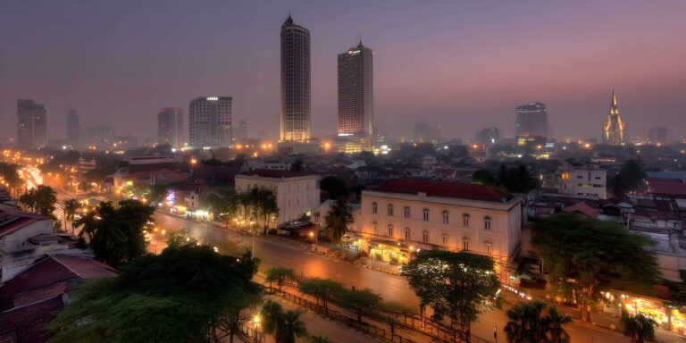 a-city-at-night-with-tall-buildings-and-traffic